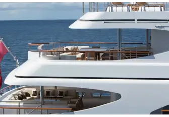 Open-air dining on the bridge deck and lounge seating on the main deck