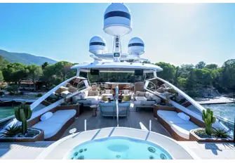 Looking aft from the jacuzzi across the shaded lounge towards the bar