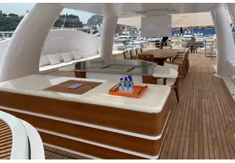 Just aft of the jacuzzi is the bar with Teppanyaki grill, open-air dining, flip-down TV for the cinema experience and a large sun lounge aft