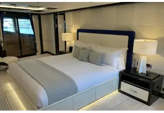 Looking to starboard in the owner's suite with the balcony's teak decking through the sliding glass doors