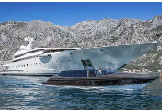 The yacht's Vikal tenders are stowed behind shell doors on the main deck aft