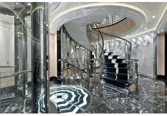 The steel and glass elevators, marble and rivetted aluminium staircase evoke the optimism of a new industrial age