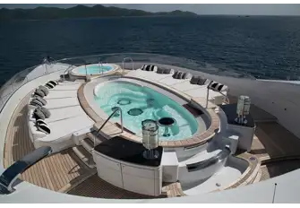 The sun deck's 7.5m (24.6ft) oval pool, jacuzzi forward and waterfall feature aft