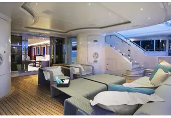 A comfortable lounge area on the main deck aft, shaded by the overhang