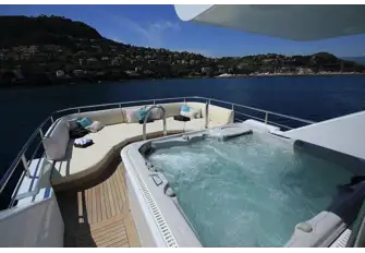 Aft is a raised jacuzzi and a bank of sunpads