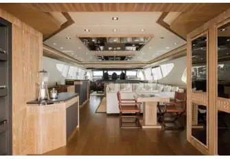 Looking forward into the Balducci-designed main saloon with its gaming table, lounge, bar and dining area