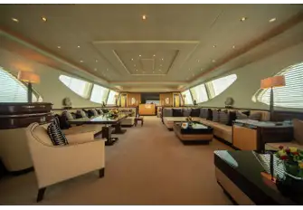 Looking forward in the main saloon, from the lounge and bar area to daybeds beneath skylights forward