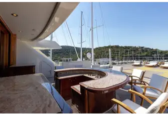 The forward sun deck has a large sun lounge with optional shade from removable awnings and aft is a sit-up bar and helipad