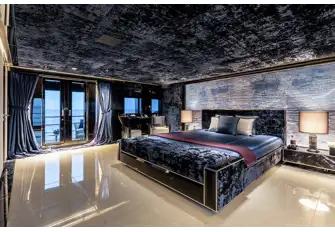 The main deck owner's suite is full beam and features folding balconies either side