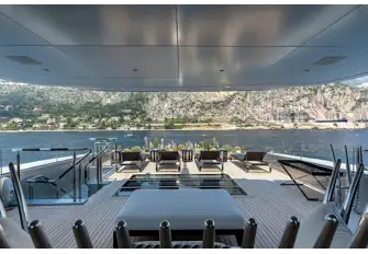 The view from the gym under the hardtop towards the sun lounge and cactus garden. Deck skylights are a feature throughout this yacht