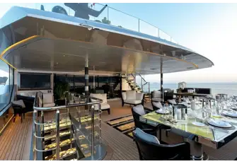 An impressive al fresco dining arrangement on the upper deck aft