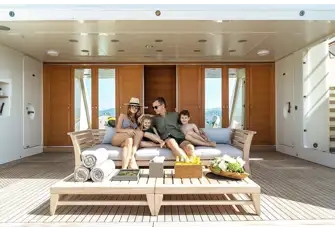The transom folds down to reveal a spacious beach club with a large swim platform
