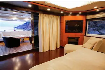 Aft on the upper deck, the master suite looks across its own terrace and has walkaround side decks for you to take in the 360 views&nbsp;