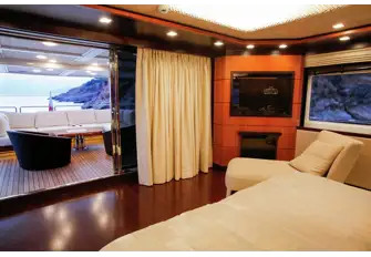 Aft on the upper deck, the master suite looks across its own terrace and has walkaround side decks for you to take in the 360 views