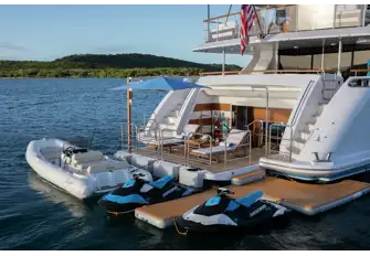 The large swim platform and beach club, with tender and toys from the lower deck garage