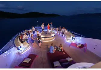 When night falls, the vibe changes from chilled pool party to serious dancing