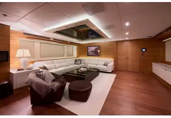 The main saloon has L-shaped sofa seating forward to port