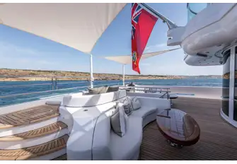 TALISMAN C - Seating, sunpads and steps to the beach club on the main deck aft