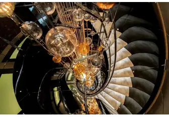The spectacular glass artwork around which the stairs spiral