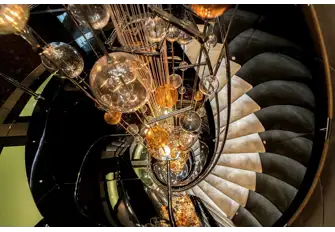 TALISMAN C - The spectacular glass artwork around which the stairs spiral