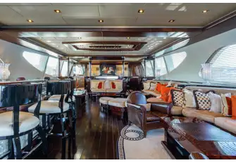 Looking forward in the main saloon, from the bar and saloon seating towards the dining table with skylights