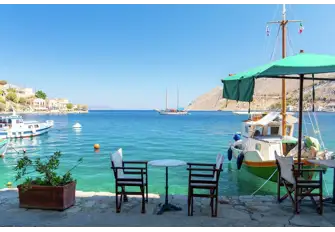 An idyllic taverna scene on a peaceful fishing quay