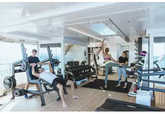Workout with a personal trainer in an air-conditioned gym