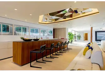 The beach club links the swim platform to the pool, wellness spa and gym