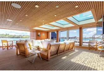 The beach club is open on three sides and skylights in the pool above