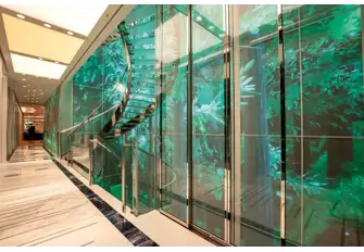 A huge interactive video wall extends up five decks