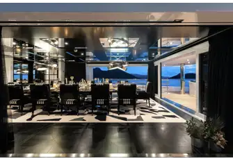 Spectacular views through full height windows from the upper deck's formal dining room