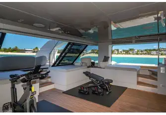 Folding sea terraces extend beyond the swim platform, opening up the beach club, and the glazed transom presents wraparound sea views