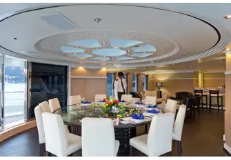 The upper deck dining room with wraparound views and the skylight above