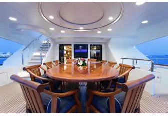 Open air dining on the bridge deck aft