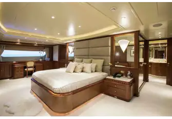 The berth in the full beam owner's suite faces aft, with the bathroom behind it