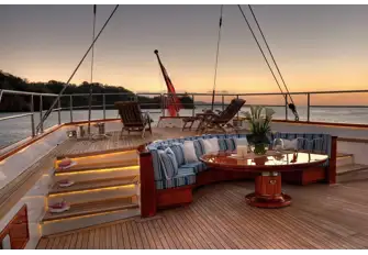 A seating area for informal dining and drinks and a raised sun lounge area aft