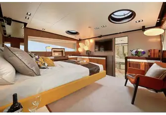 The split-level owner's suite with steps into the bathroom forward