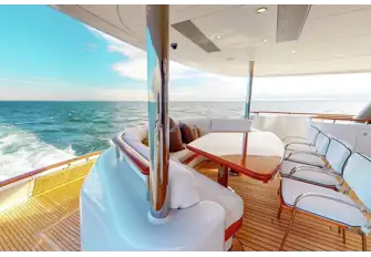 The main deck aft lounge and steps leading down to the swim platform with its folding section