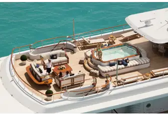 Sun lounge aft, large jacuzzi midships and shaded dining forward