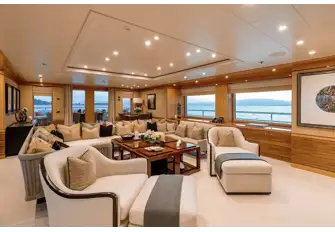 Seating in the sky lounge faces a large TV screen on the forward bulkhead
