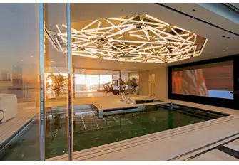Looking from the starboard sea terrace, across the pool to the gym and the port sea terrace