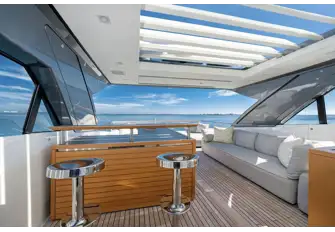 The flybridge has side windows that lower and a sunroof