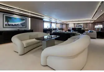 Looking forward in the main saloon across a cosy lounge, larger lounge and formal dining forward