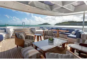 Lounge area forward of the bar beneath the glazed hardtop