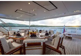 Dining and sun lounges on the bridge deck aft