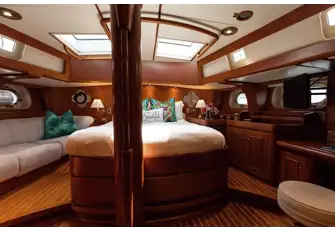 The owner's suite is full beam with handrails above the berth for safety underway