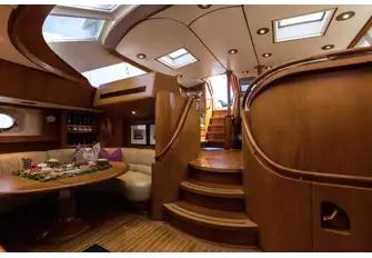 The lower saloon has great natural light, dining to starboard and a TV to port