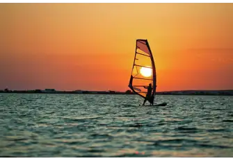 The westerly breeze makes this beach a windsurfer's mecca