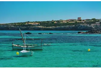 The waters off Es Pujols are impossibly inviting