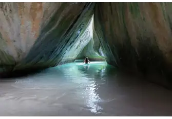 Swim through the hidden caves and grottos